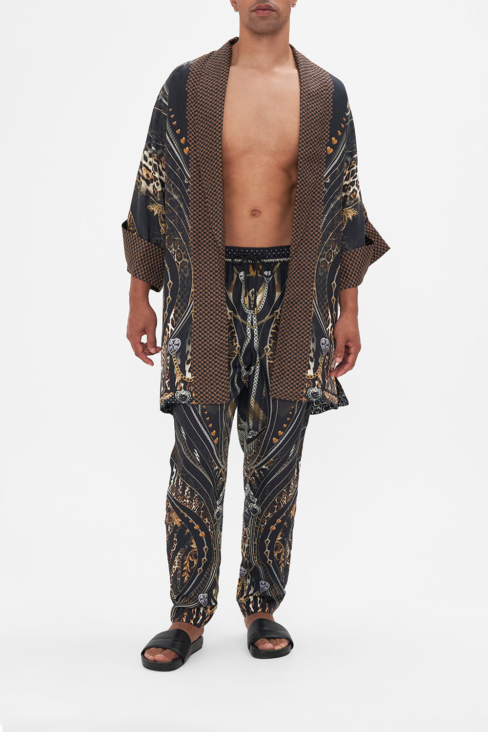 Front view of model wearing Hotel Franks by CAMILLA mens silk robe in Chaos In The Cosmos animal print