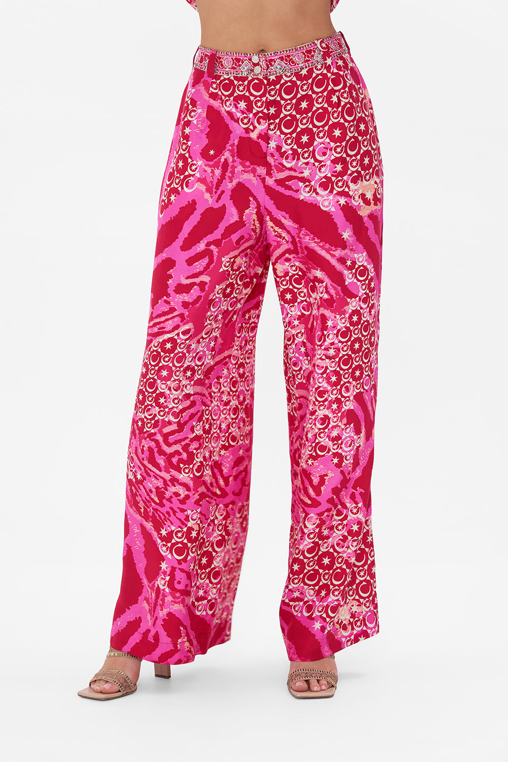 Crop view of model wearing CAMILLA silk palazzo pants in Song Of Sacrifice print