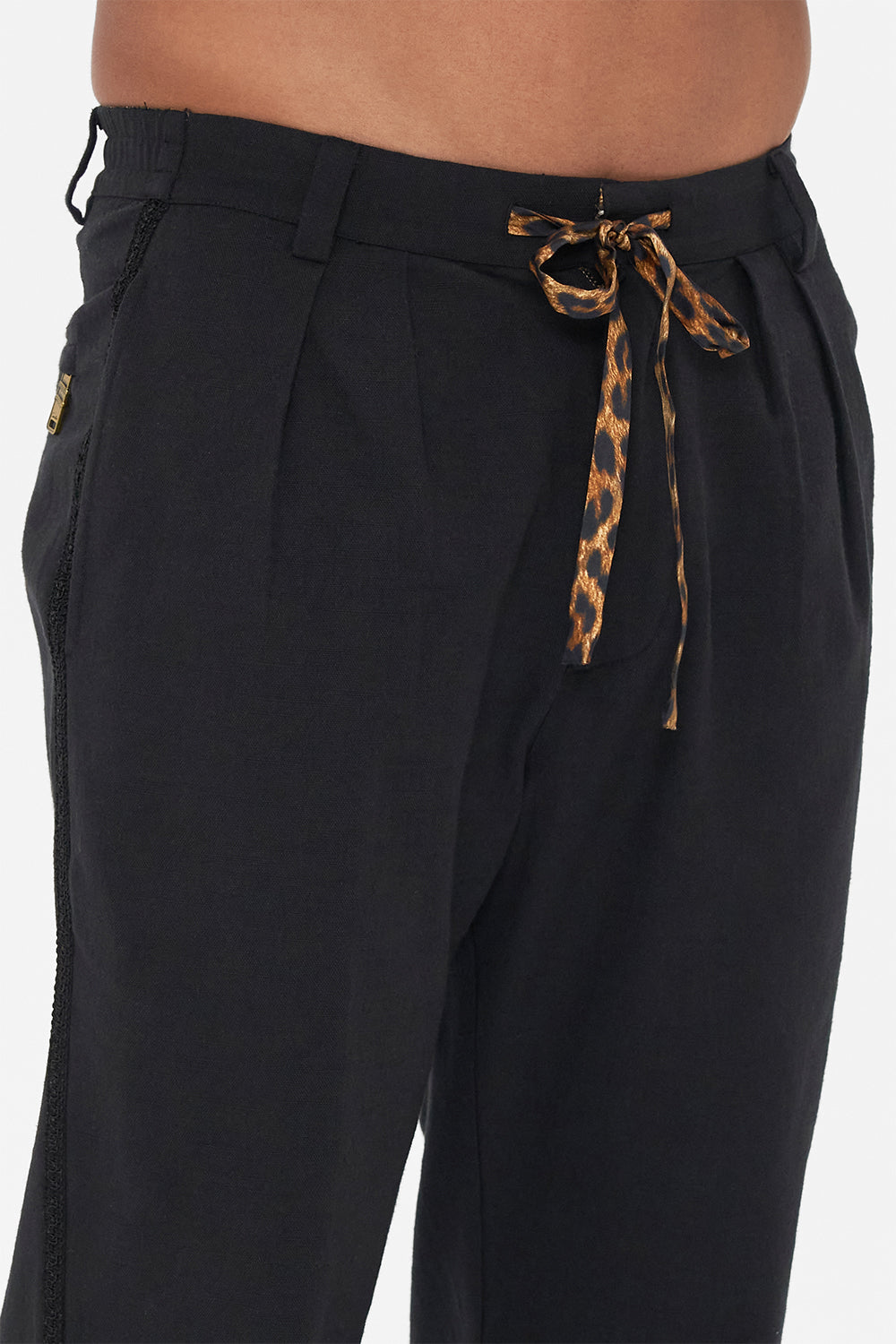 Detail view of model wearing Hotel Franks by CAMILLA mens black pleat front pants Jungle Dreaming