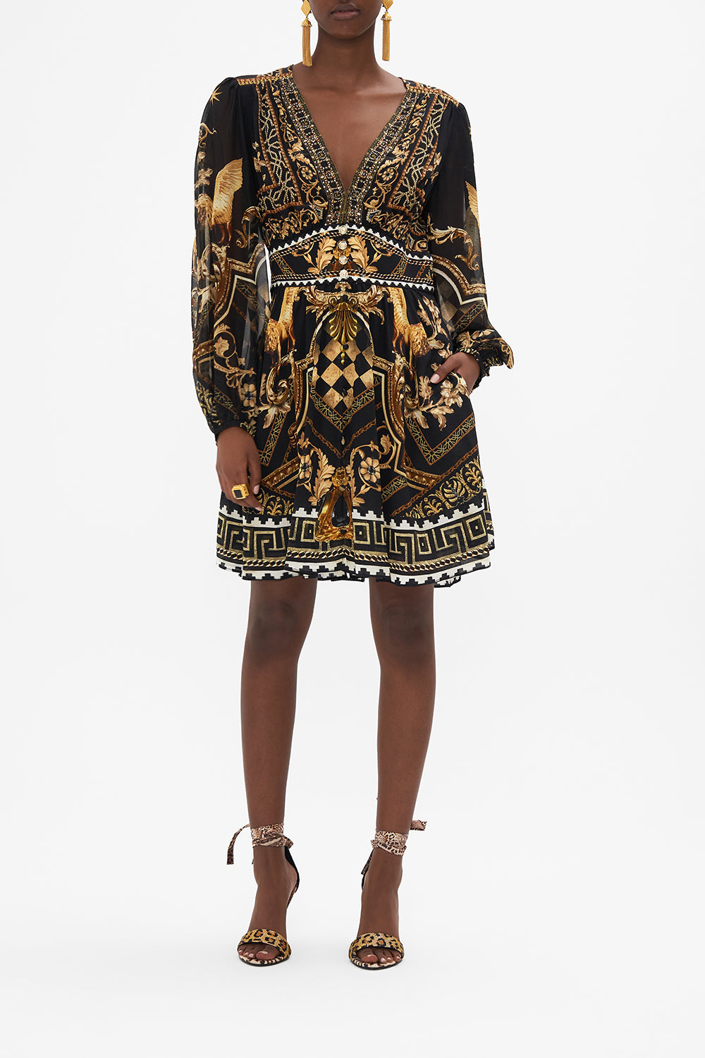 Front view of model wearing CAMILLA black and gold mini dress in Duomo Dynasty print