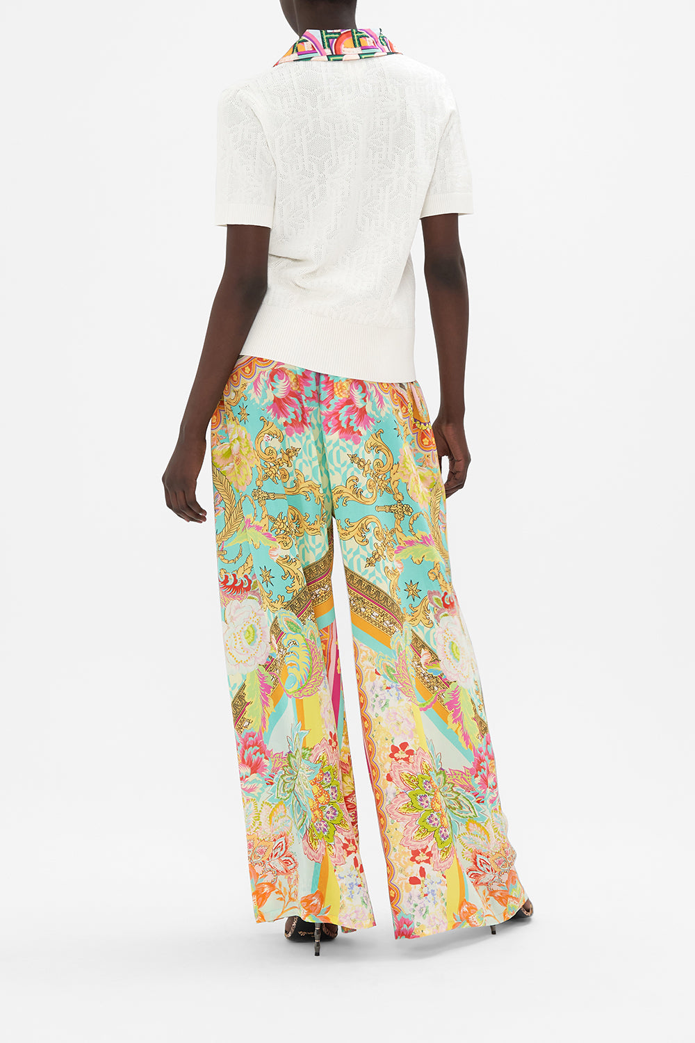 Back view of model wearing CAMILLA white knit polo top in An Italian Welcome print