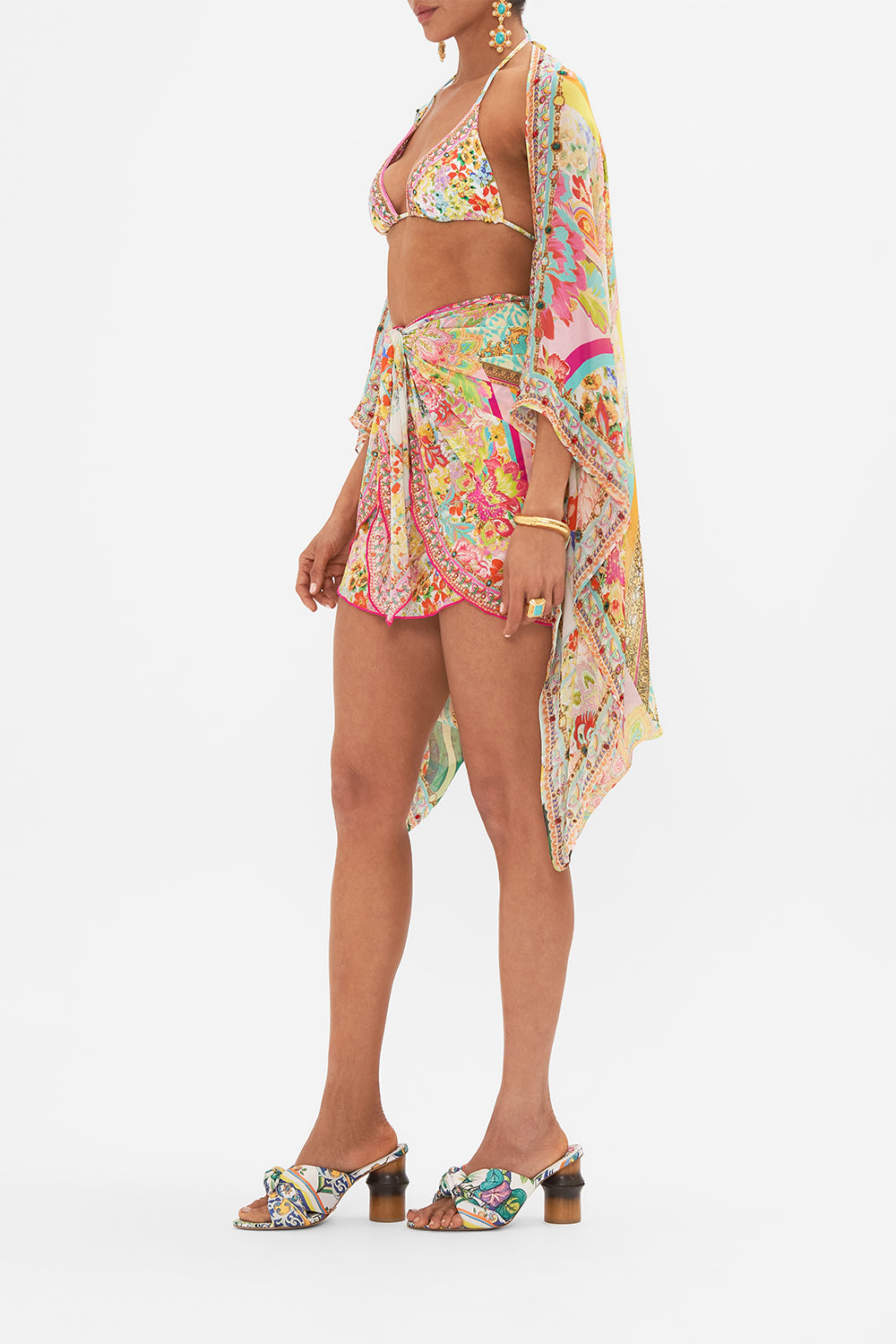 Side view of model wearing CAMILLA silk shrug in An Italian Welcome print