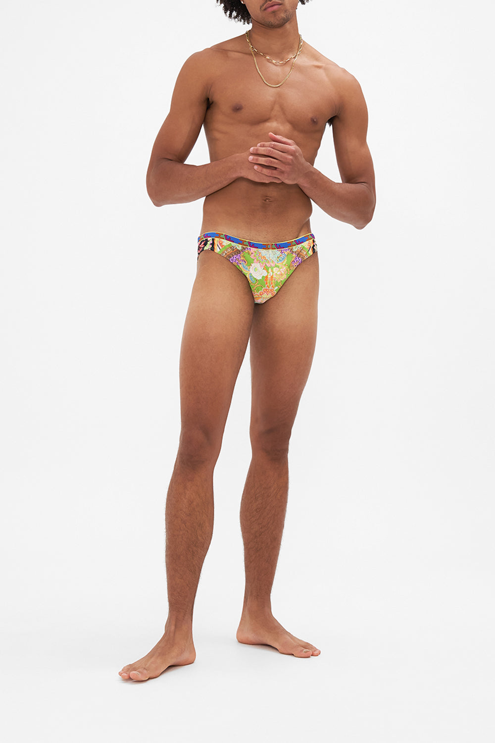 Front view of model wearing HOTEL FRANKS BY CAMILLA mens swim in Sundowners in Sicily print