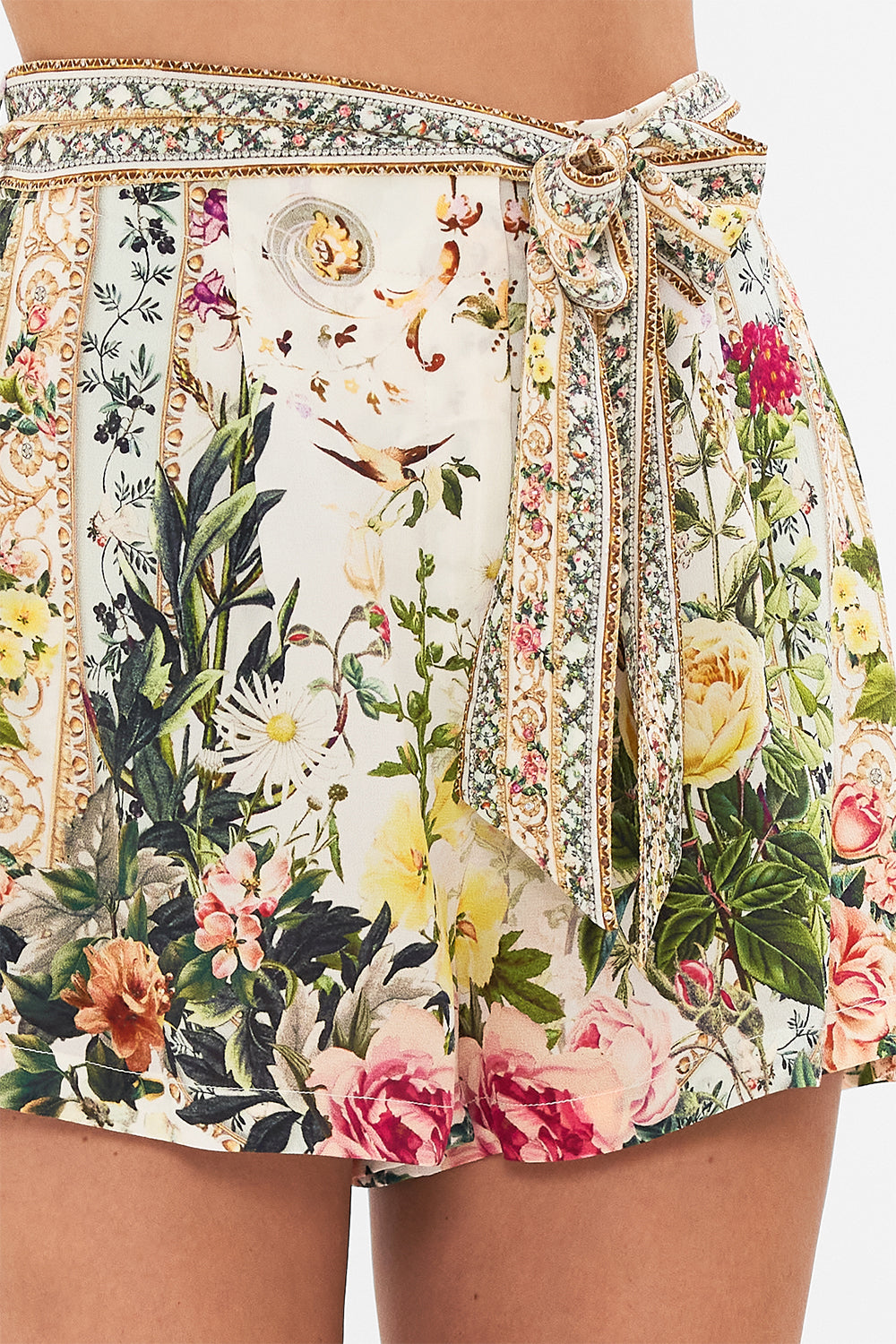 Detail view of model wearing CAMILLA silk shorts in Renaissance Romance print