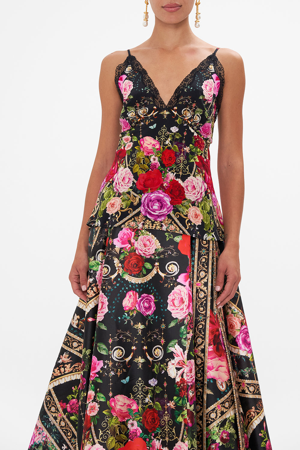 Detail view of model wearing CAMILLA silk cami with lace edge in Reservation For Love print