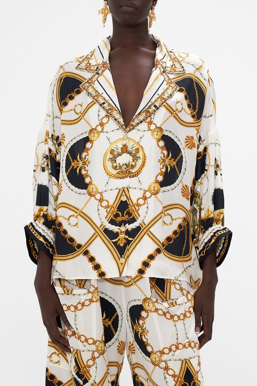 Detail view of model wearing CAMILLA silk shirt in Sea Charm print