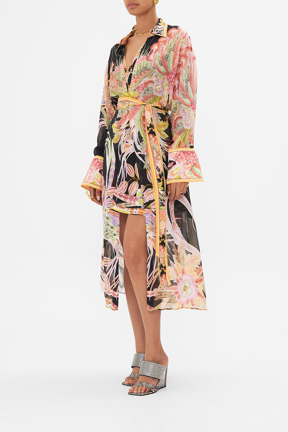 Side view of model wearing CAMILLA silk kimonop layer in Lady of the Moon print