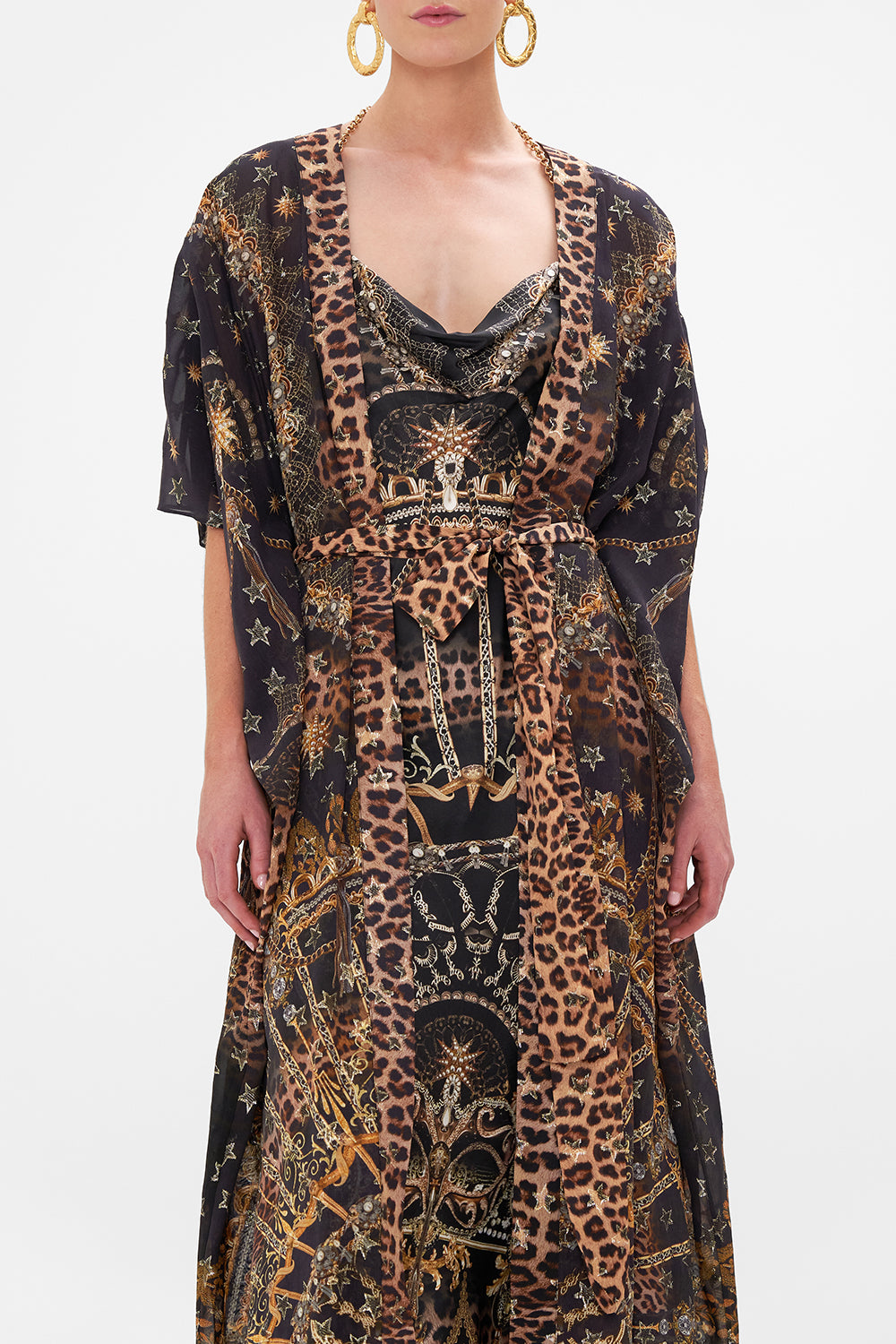 Crop view of model wearing CAMILLA lurex outerwear layer in Masked Moonlight print