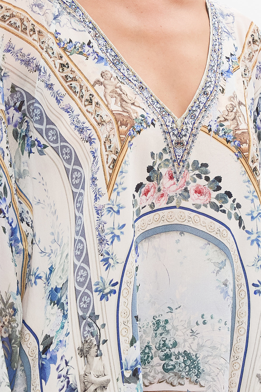 Detail view of model wearing CAMILLA silk kaftan in Season of The Siren print