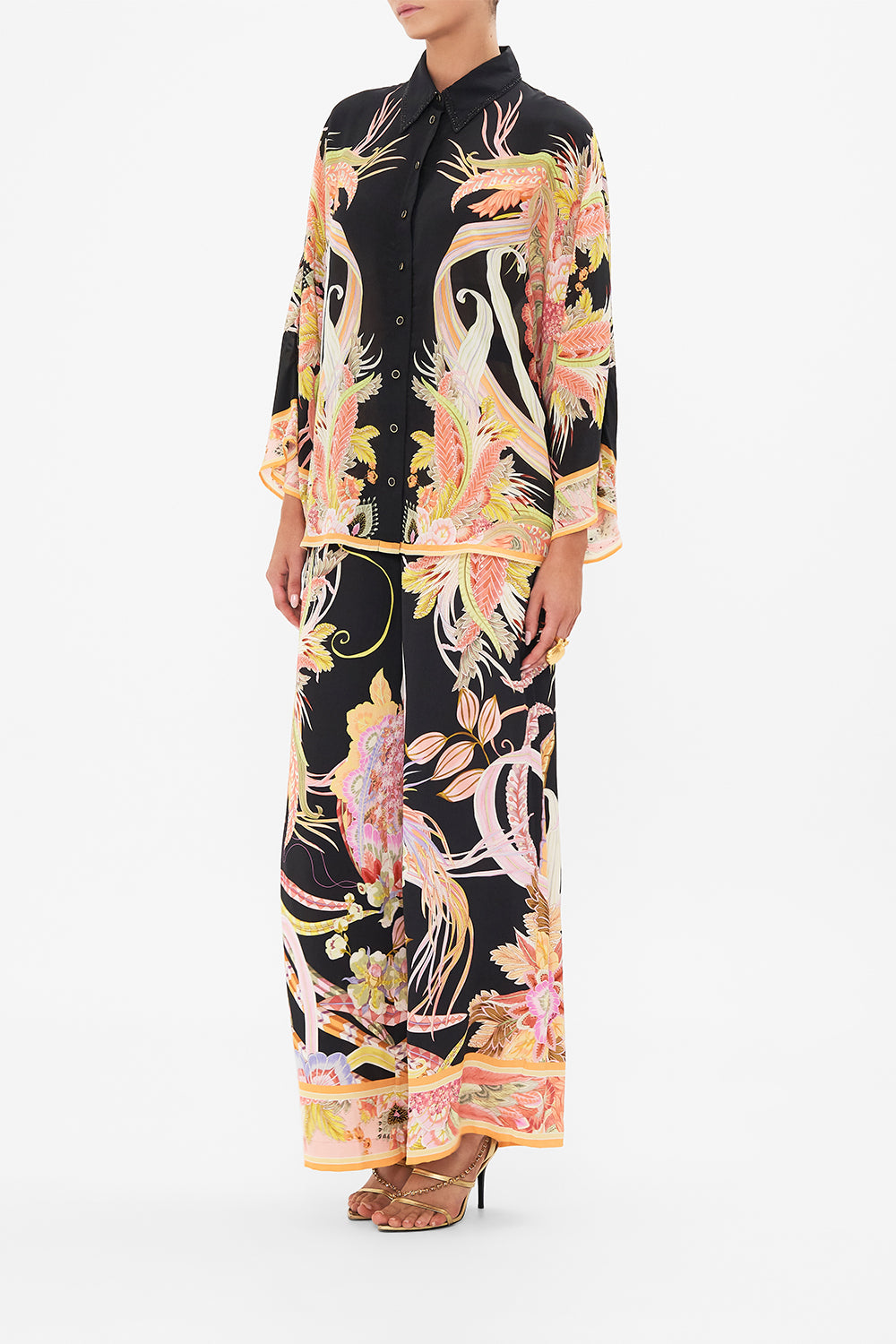 Side view of model wearing CAMILLA silk blouse in Lady Of The Moon print