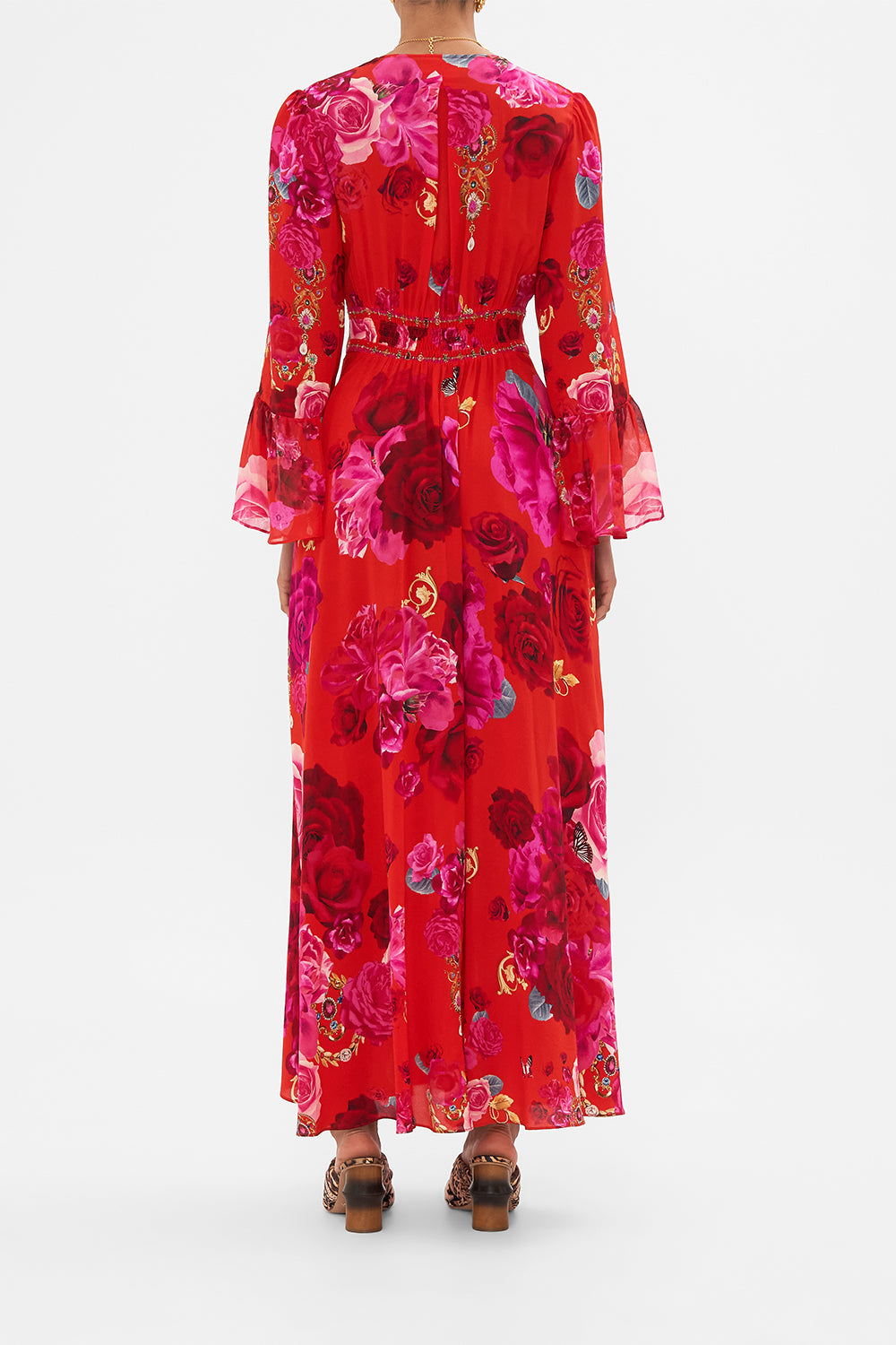 Back view of model wearing designer floral ruffle dress in An Italian Rosa print