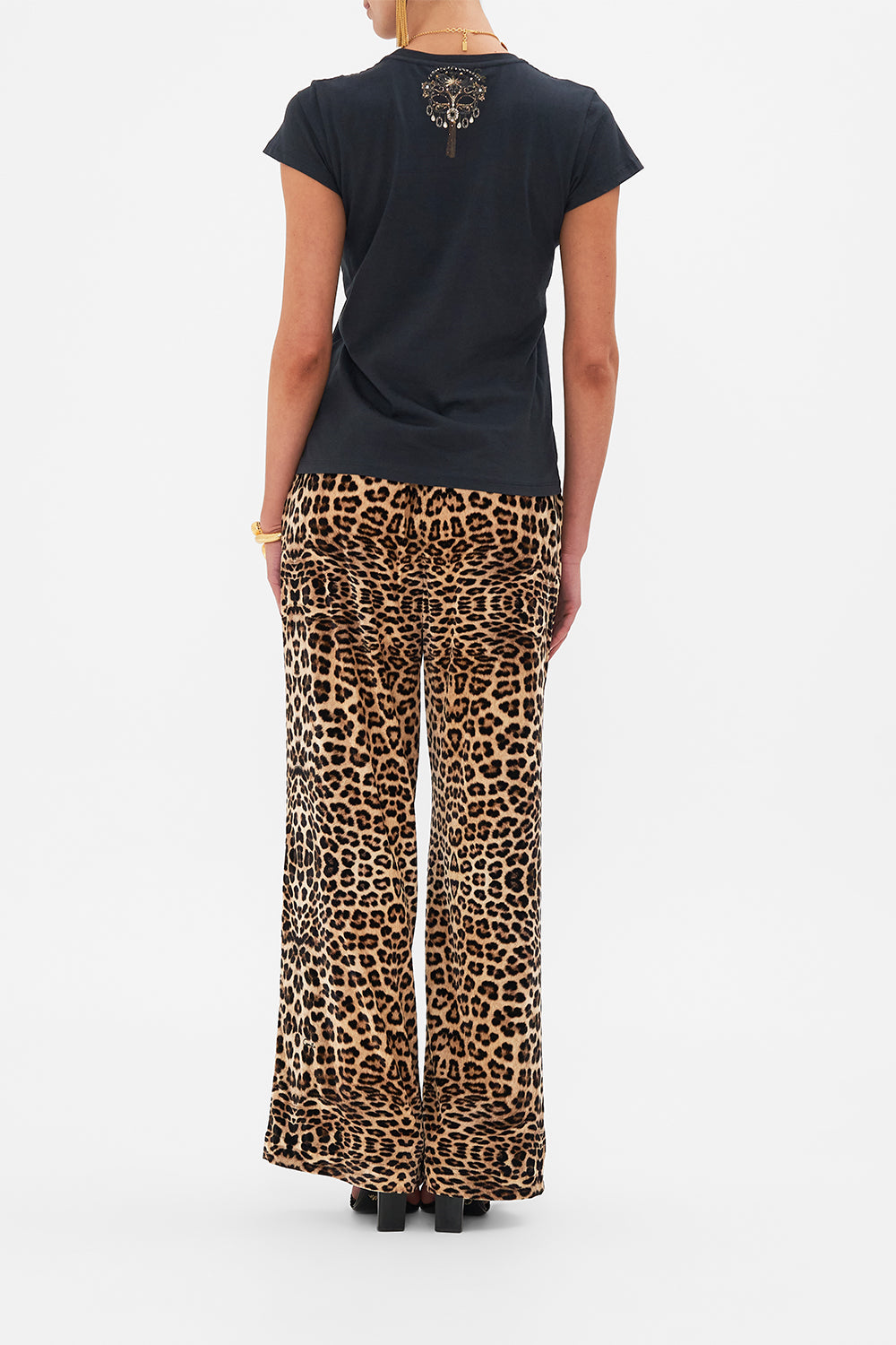 Back view of model wearing CAMILLA luxury t shirt in Masked At Moonlight print