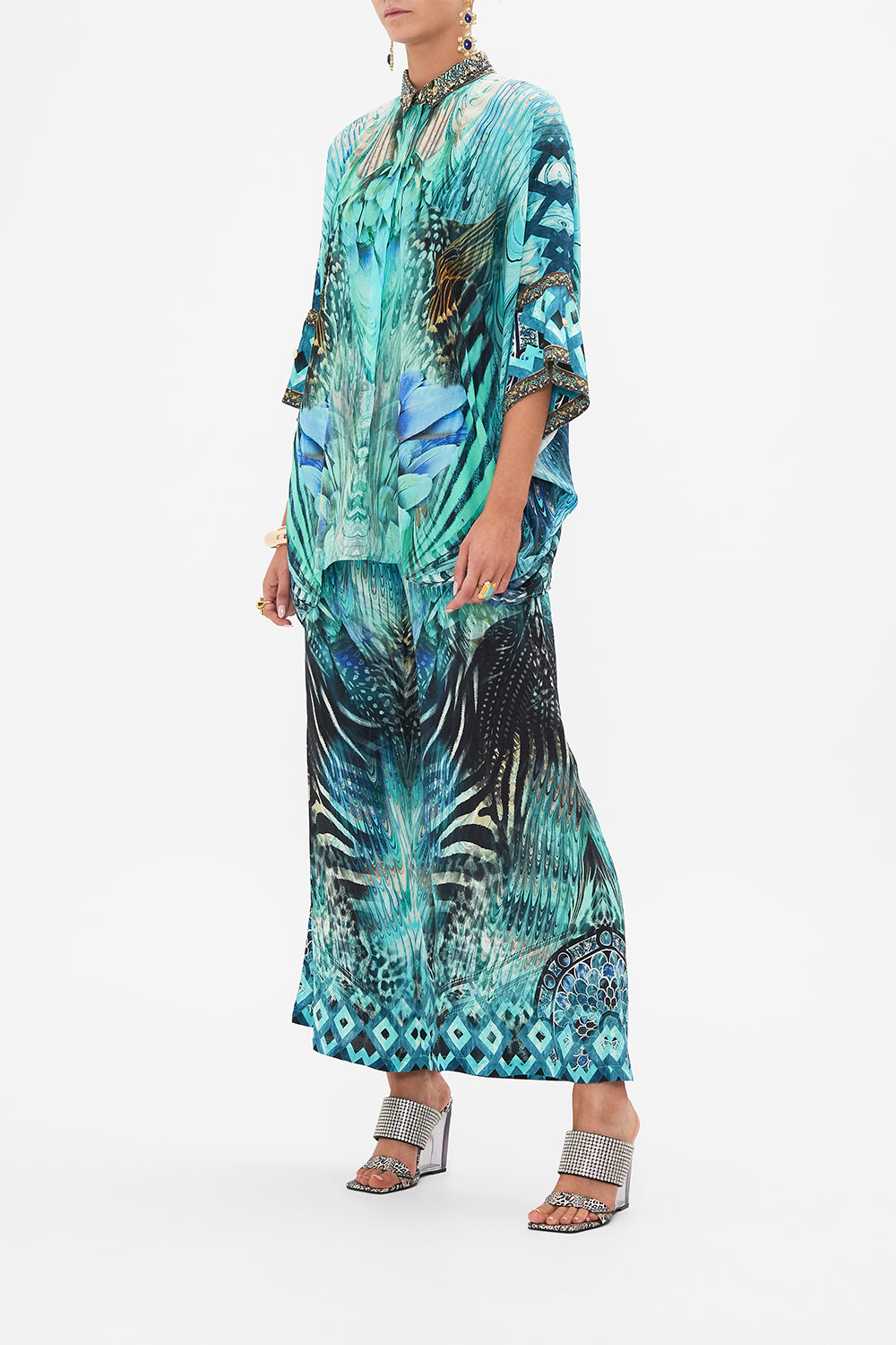 Side view of model wearing CAMILLA silk shirt in Azure Allure print