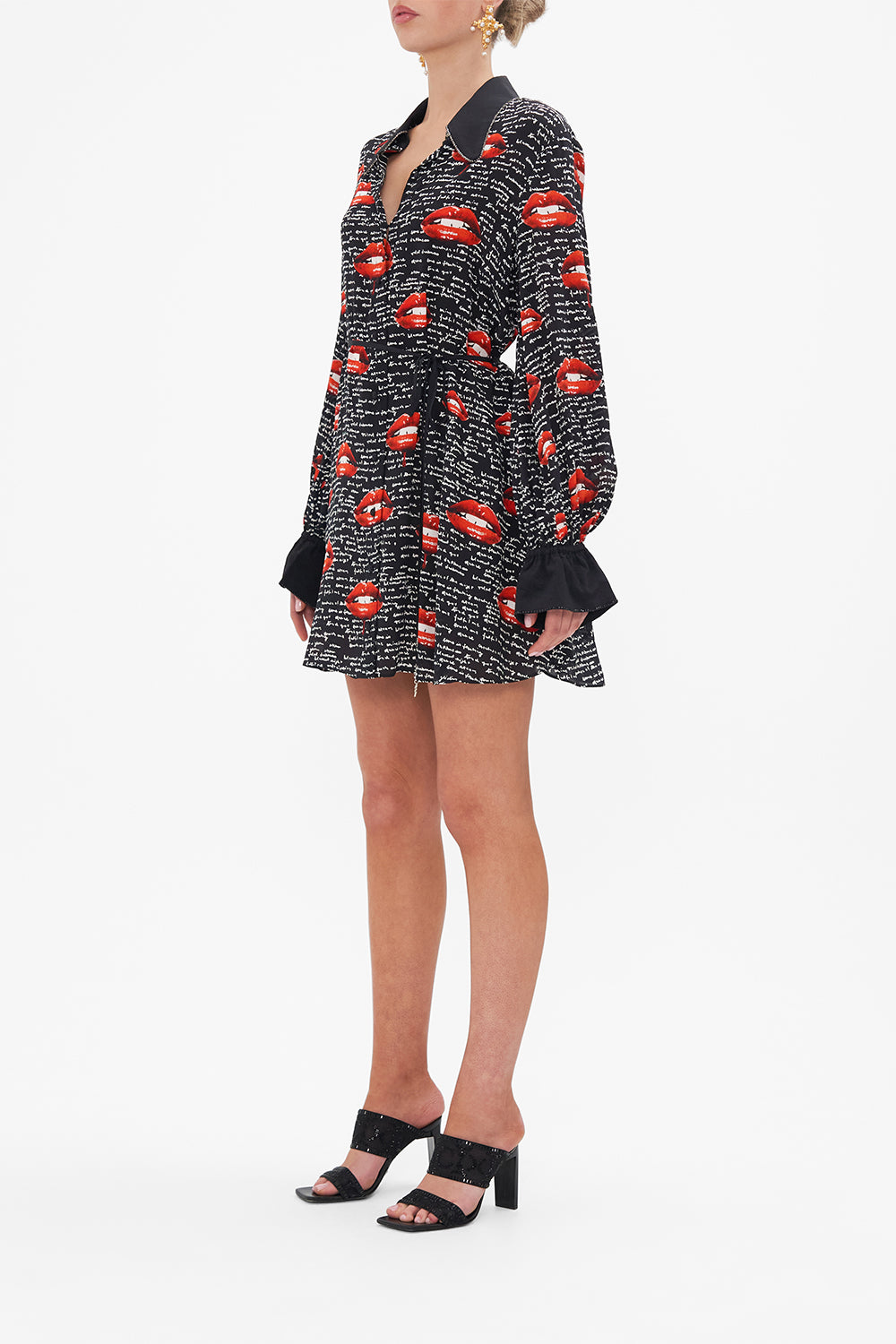 Side view of model wearing CAMILLA black silk shirt dress in Chaos Magic print