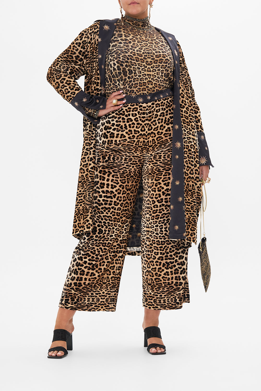 Front view of curvy model wearing CAMILLA plus size leopard print top in Soul Of A Star Gazer print