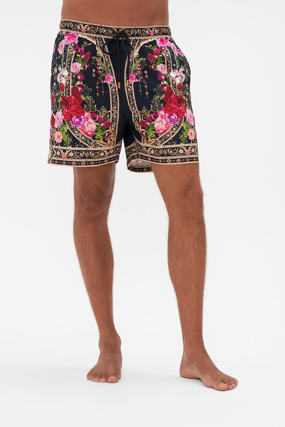 Crop view of model wearing Hotel Franks by CAMILLA mens boardshorts in Reservation For Love print