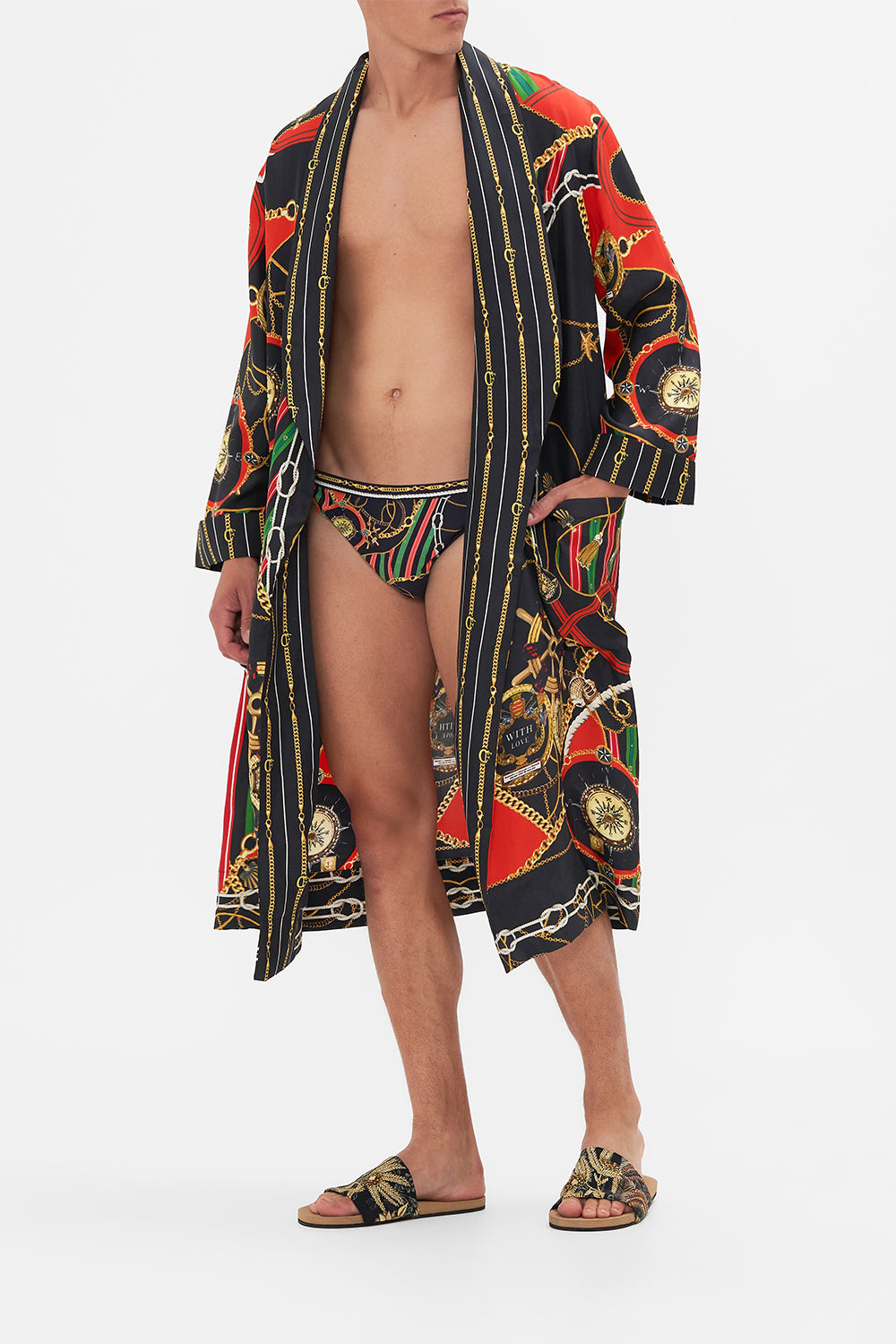 Back view of model wearing Hotel Franks By CAMILLA mens swim breif in Club Aperitivo print