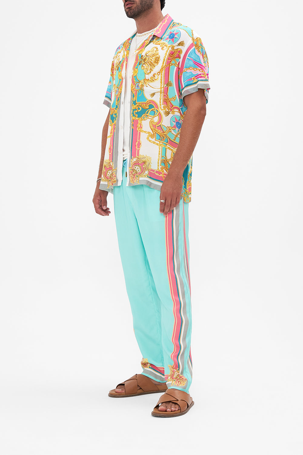 Side view of model wearing Hotel Franks By CAMILLA mens camp collared shirt in Sail Away With Me print