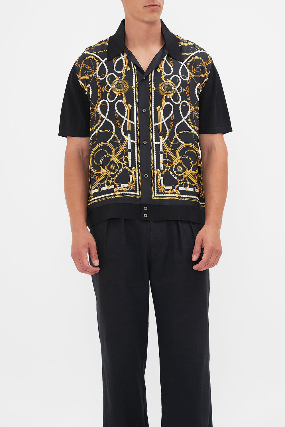 Crop view of model wearing Hotel Franks By CAMILLA mens silk shirt in Coast to Coast print