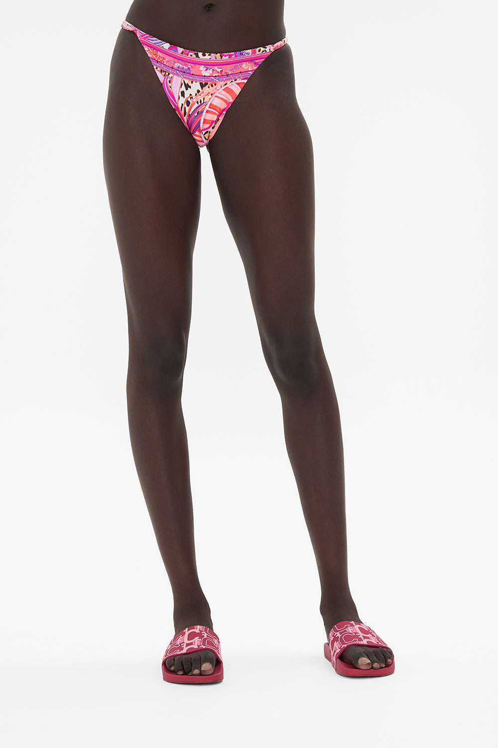 Crop view of model wearing CAMILLA resortwear bikini bottom in Viola Vintage print