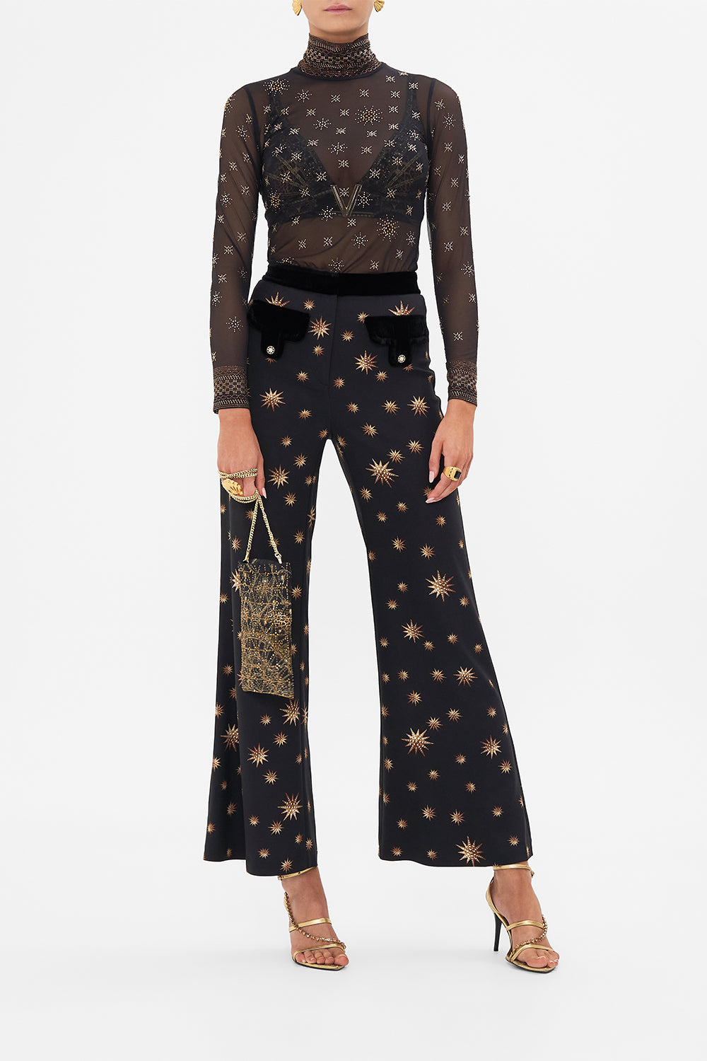 Front view of model wearing CAMILLA mesh turtleneck top in Soul Of A Star Gazer print