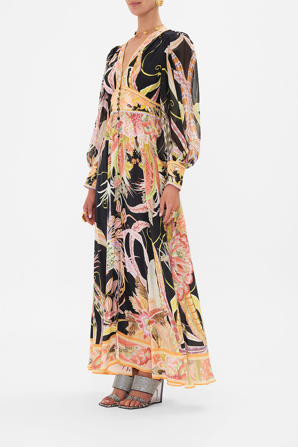 Side view of model wearing CAMILLA designer silk dress in Lady Of The Moon print