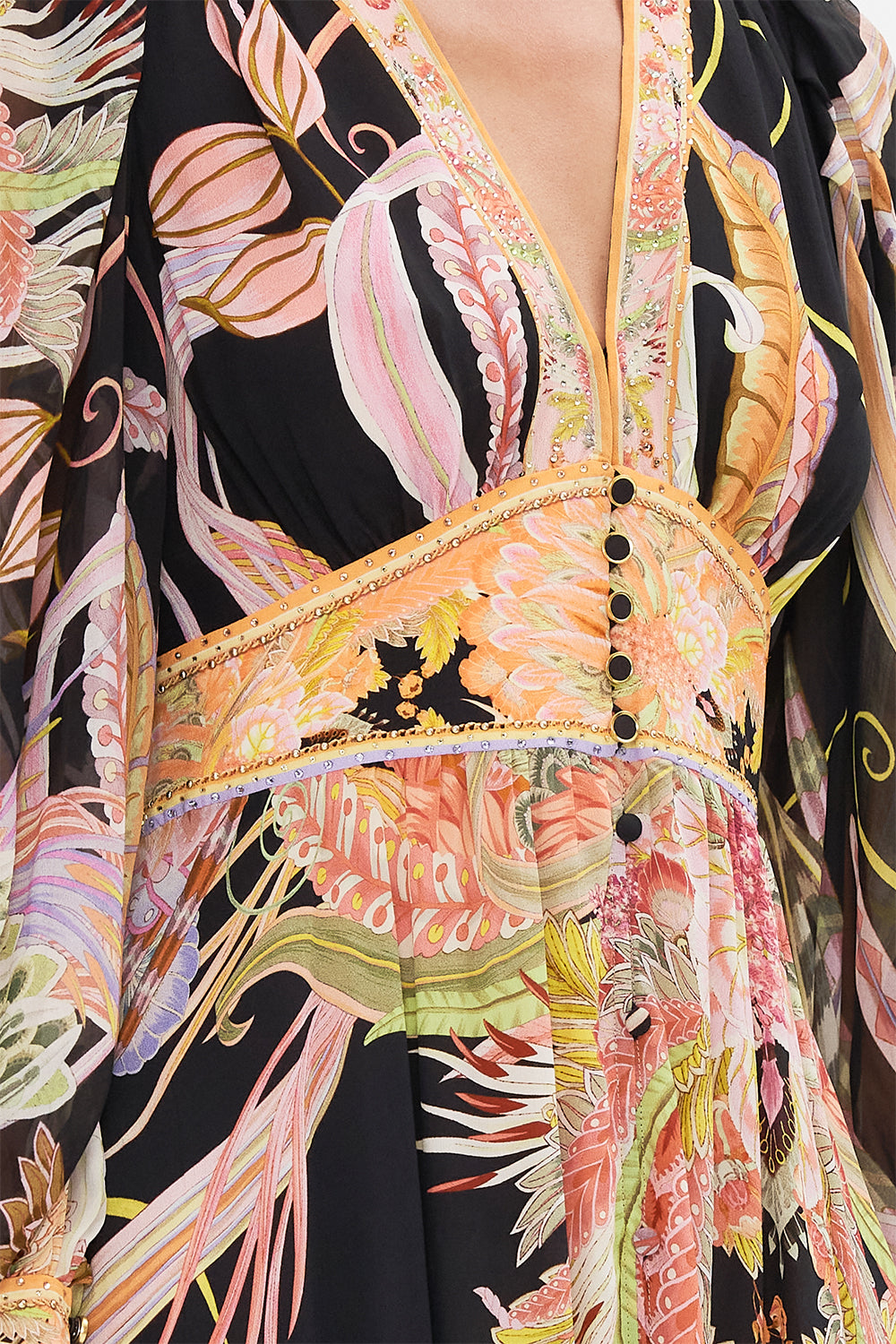 Detail view of model wearing CAMILLA designer silk dress in Lady Of The Moon print
