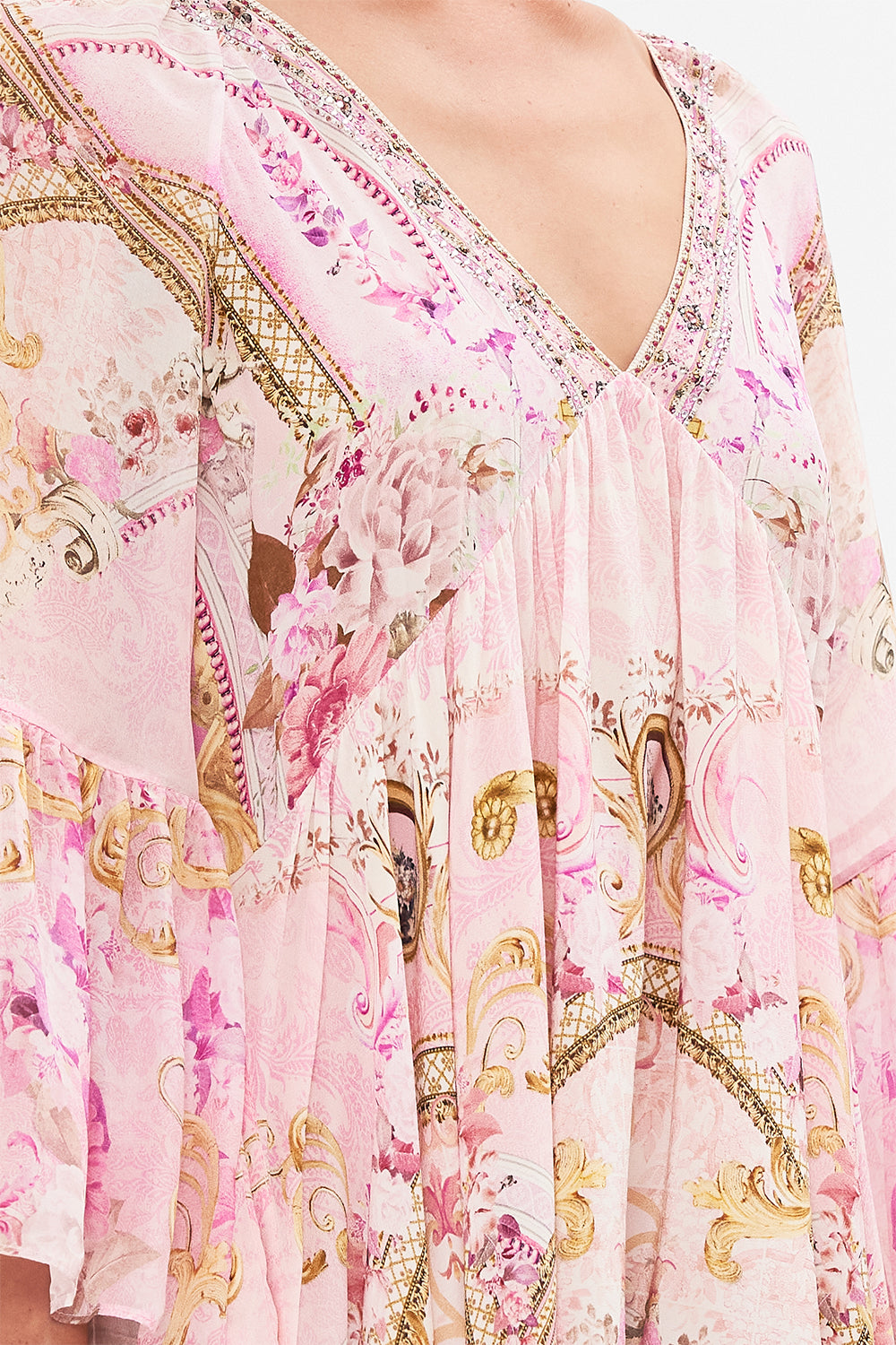 Detail view of model wearing CAMILLA pink silk dress in Fresco Fairytale print