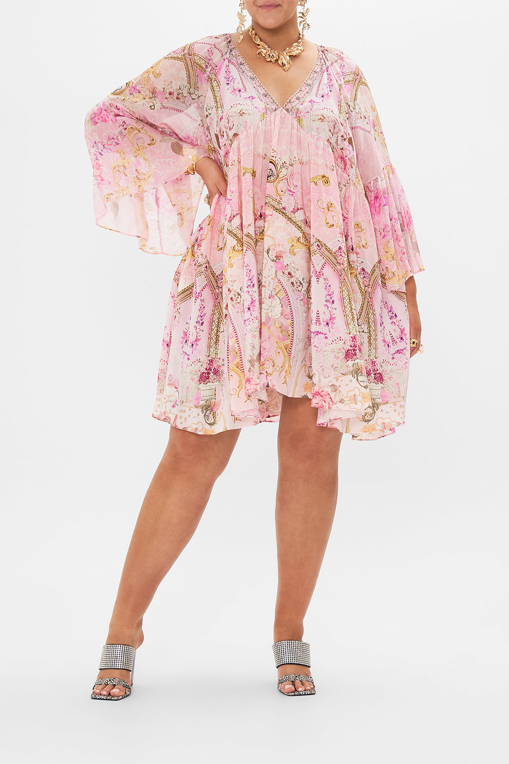 Front view of curvy model wearing CAMILLA plus size pink silk dress in Fresco fairytale print