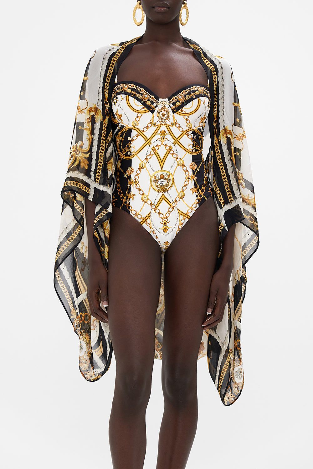 Crop view of model wearing CAMILLA silk shrug in Sea Charm print