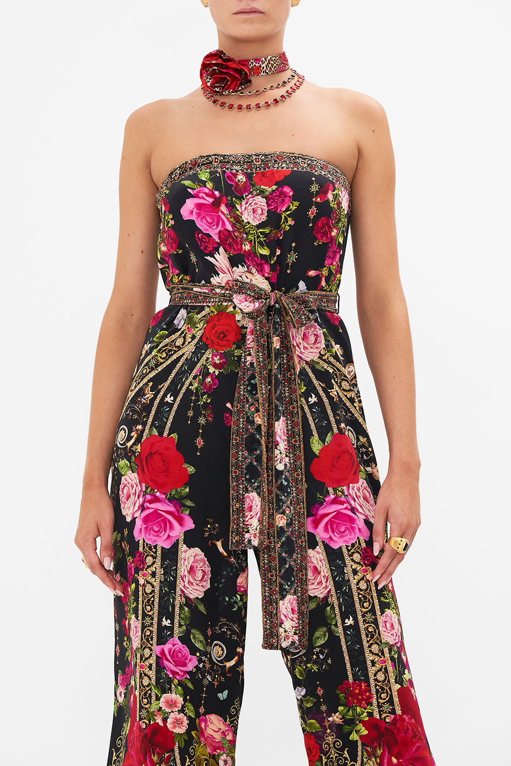 Crop view of model wearing CAMILLA floral silk jumpsuit in Reservation For Love print