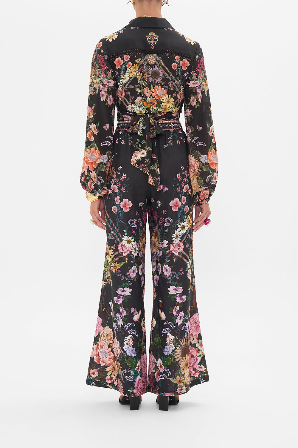 Back view of model wearing CAMILLA linen lounge pant in Letters From A Vineyard print