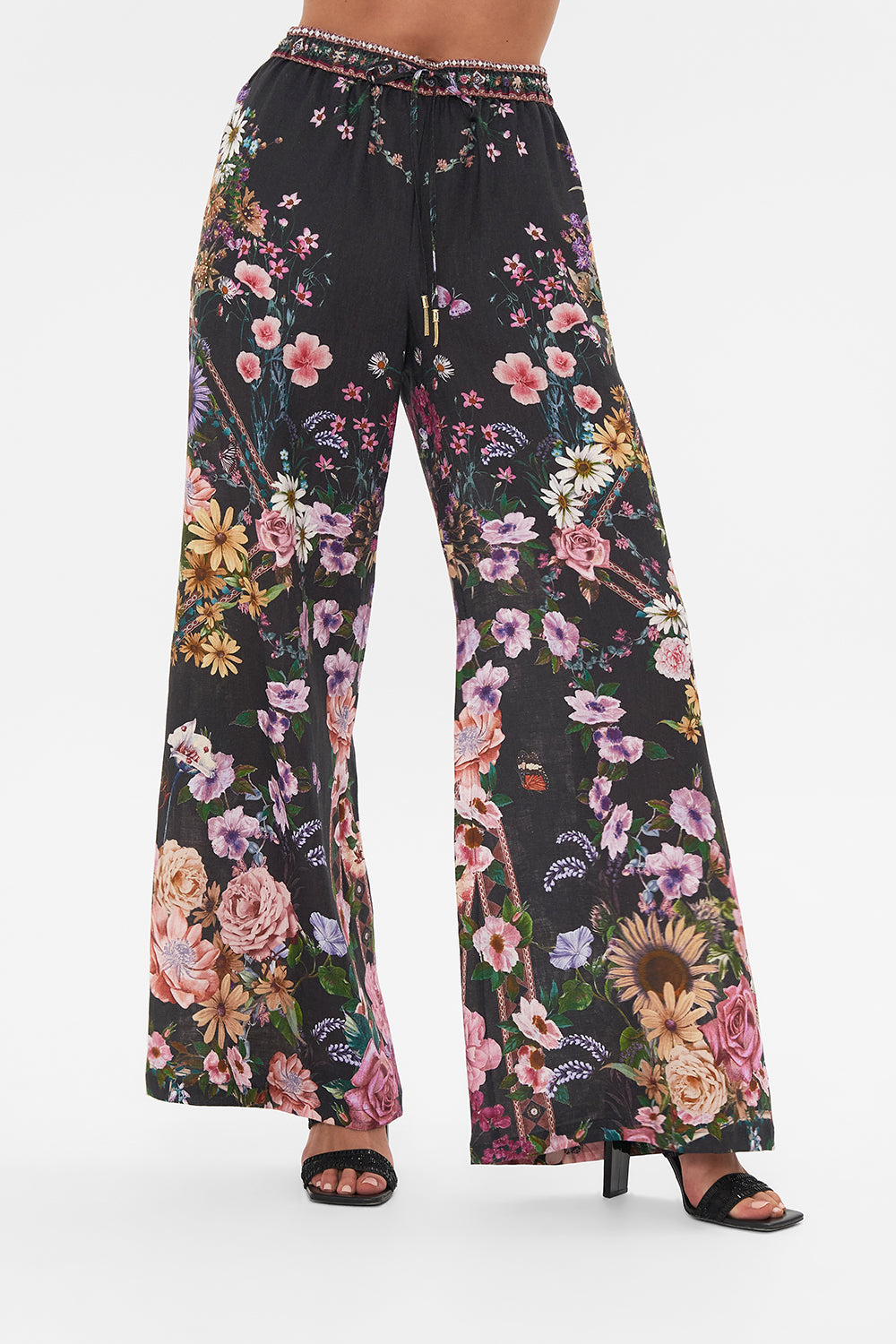 Crop view of model wearing CAMILLA linen lounge pant in Letters From A Vineyard print