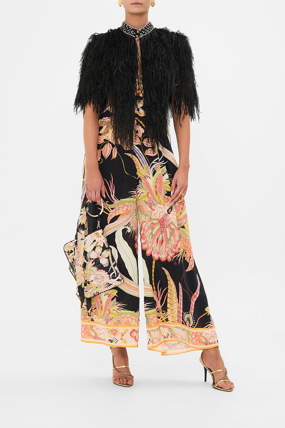 Front view of model wearing CAMILLA beaded feather gilet in Lady of The Moon print