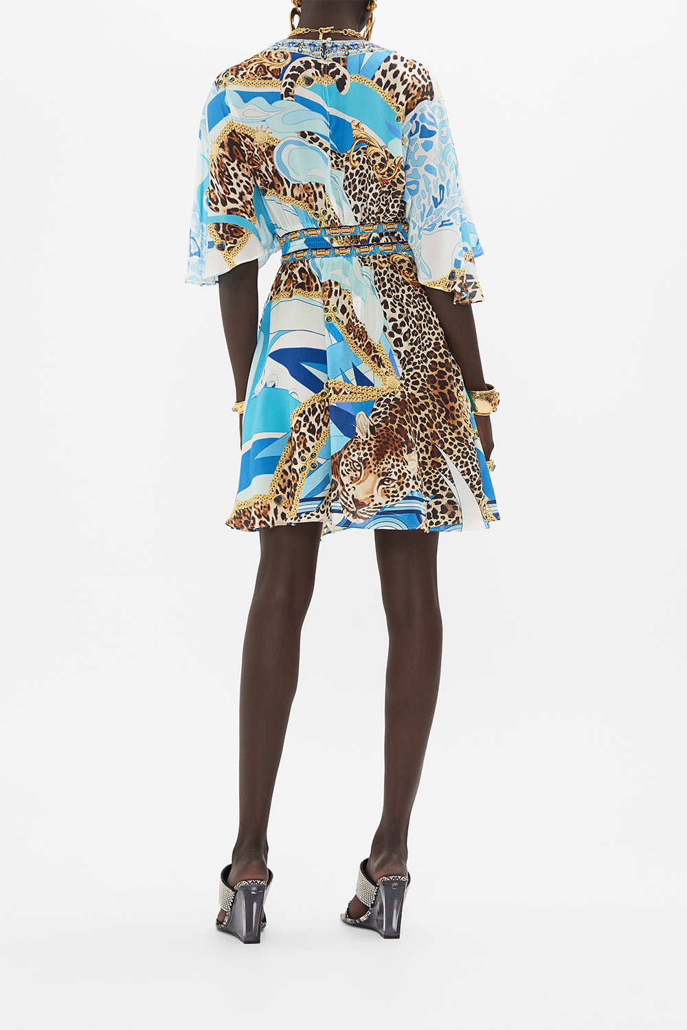 Back view of model wearing CAMILLA silk mini dress in Sky Cheetah print