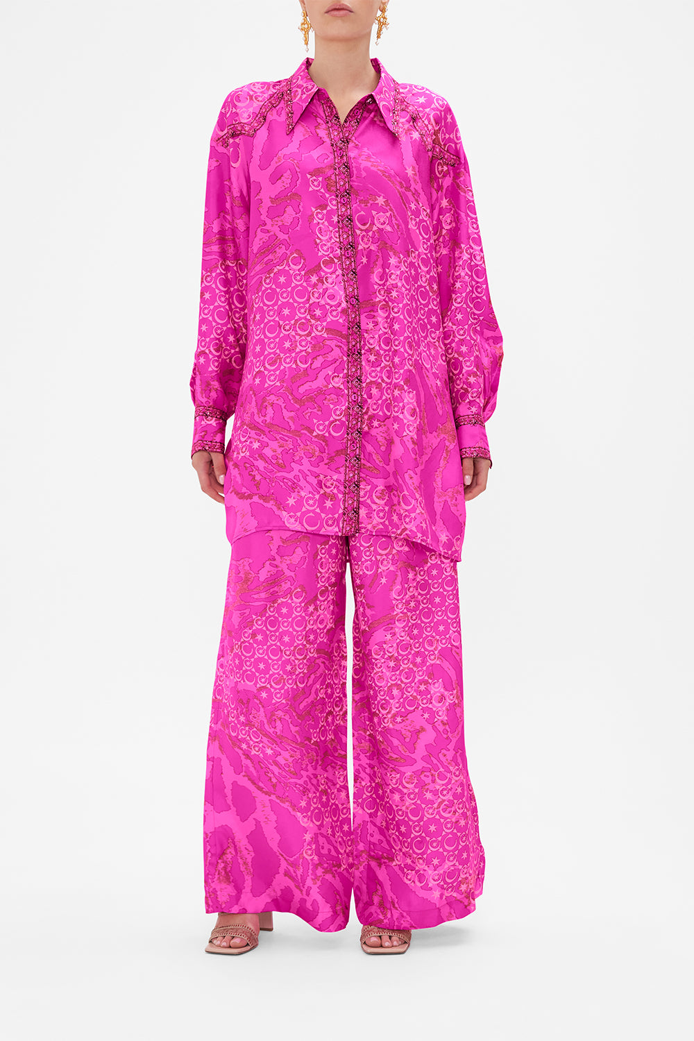 Front view of model wearing CAMILLA silk shirt in neon Song Of Sacrifice print