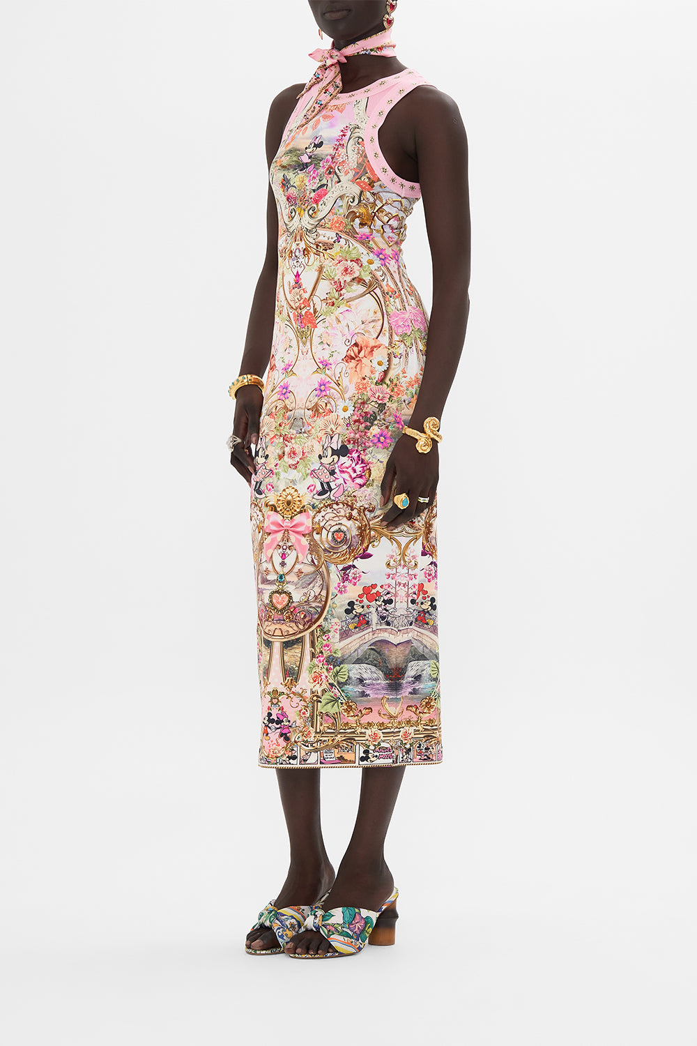 Side view of model wearing Disney x CAMILLA jersey dress in Minnie Mouse Magic print