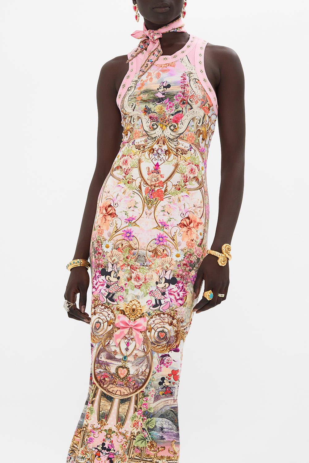 Crop view of model wearing Disney x CAMILLA jersey dress in Minnie Mouse Magic print