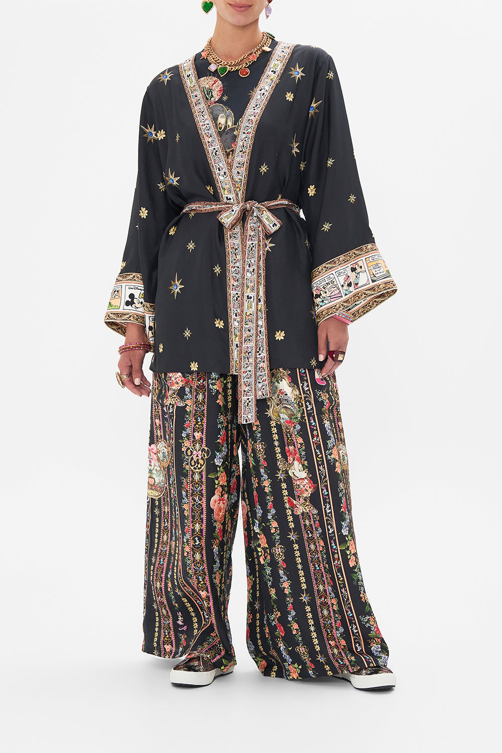 Front view of model wearing Disney x CAMILLA short silk kimono at Midnght At Minnies print