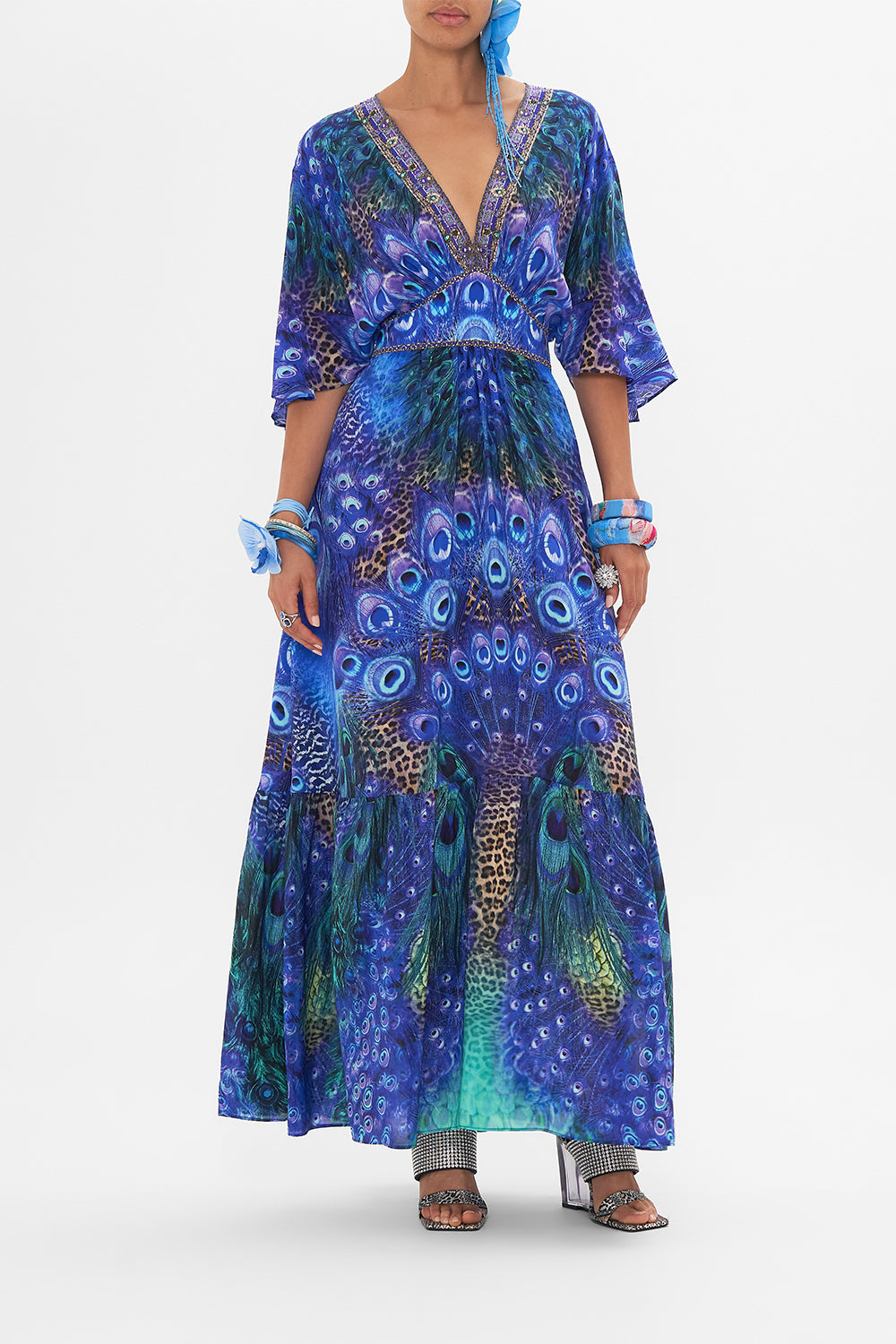 Front view of model wearing CAMILLA silk ruffle dress in Peacock Rock print