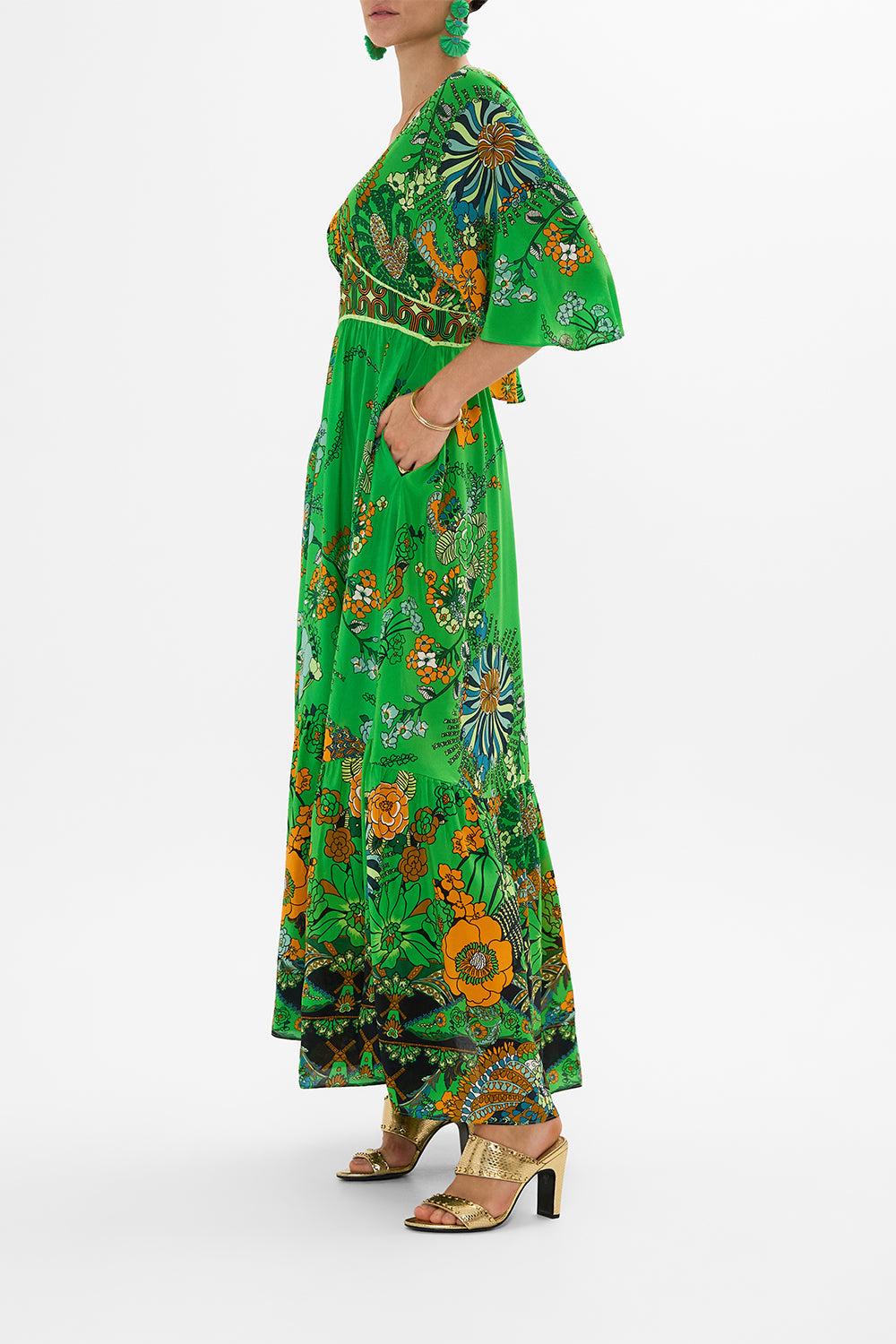 CAMILLA green waisted dress with hem ruffle in Good Vibes Generation print.