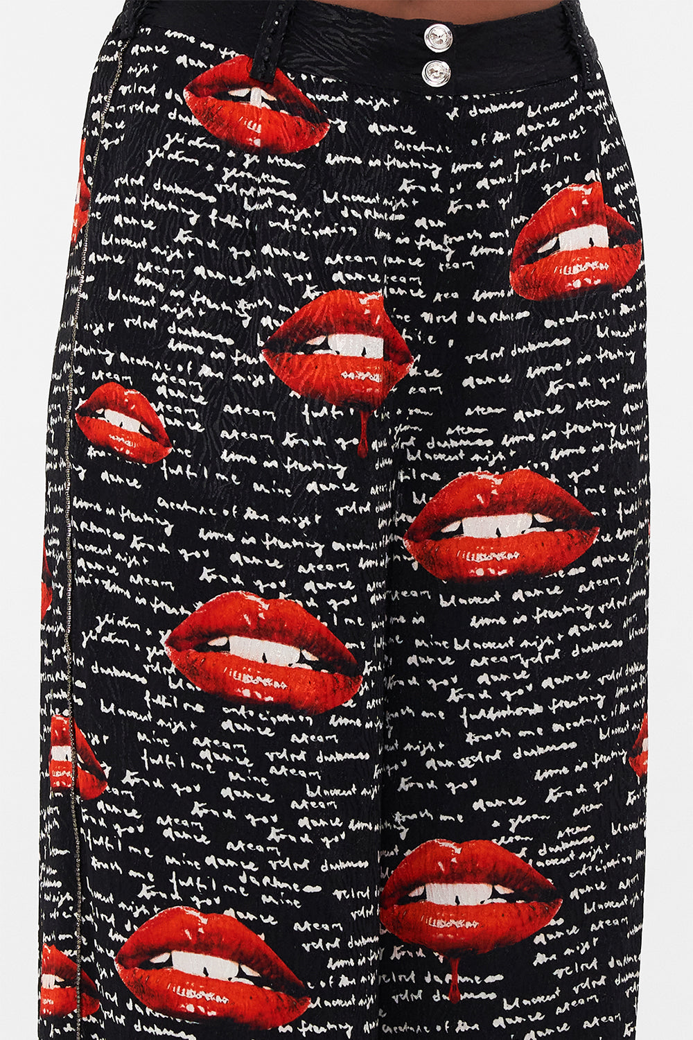 Detail view of model wearing CAMILLA palazzo pants in black Chaos Magic print