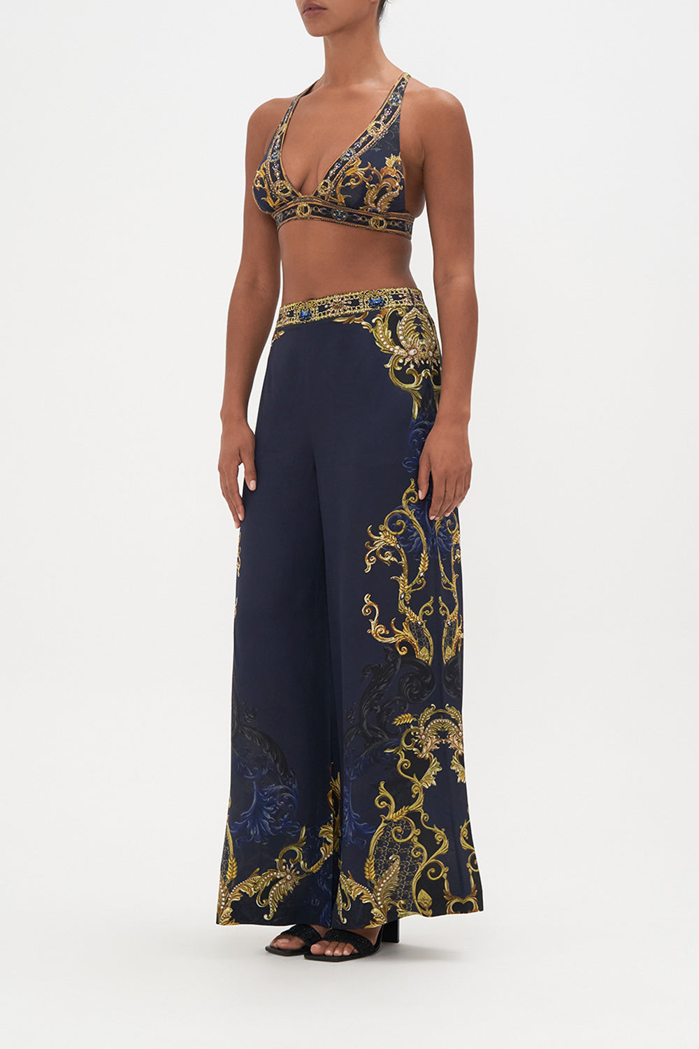 Side view of model wearing CAMILLA soft cup bra in Moonlight Melodies print