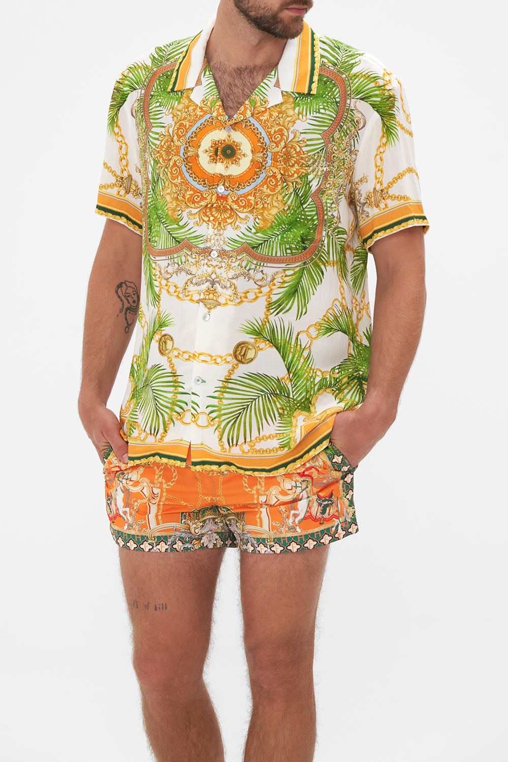 Side view of model wearing Hotel Franks by CAMILLA mens white short sleeve shirt in My Sweet Devotion print