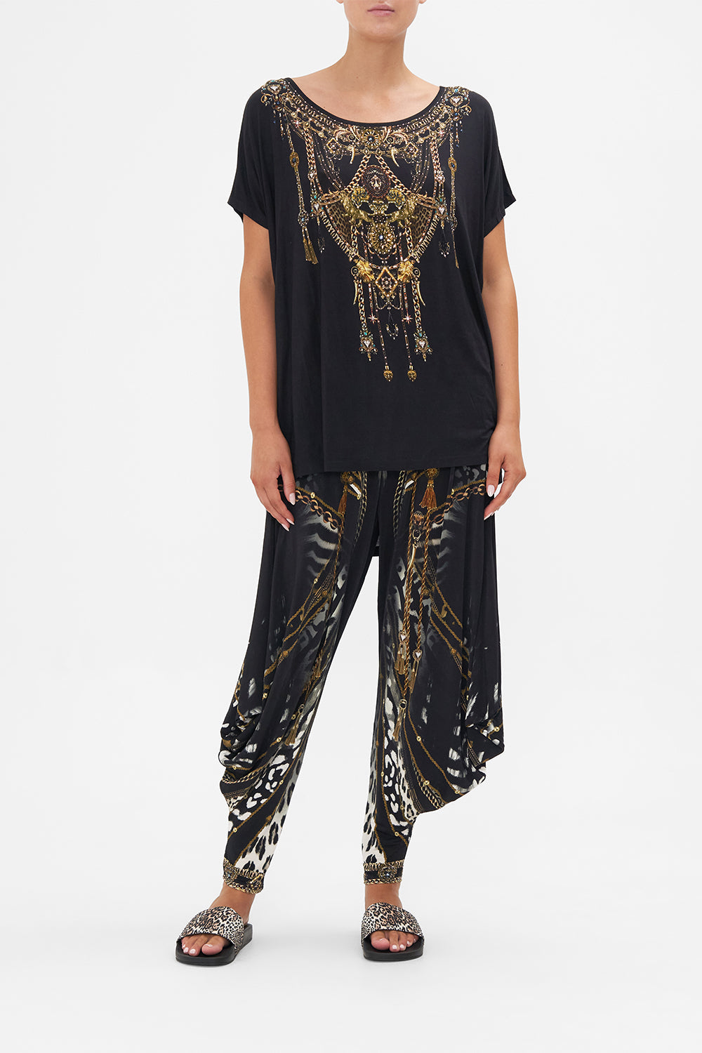 Front view of model wearing CAMILLA black t shirt in Untamed Royalty print