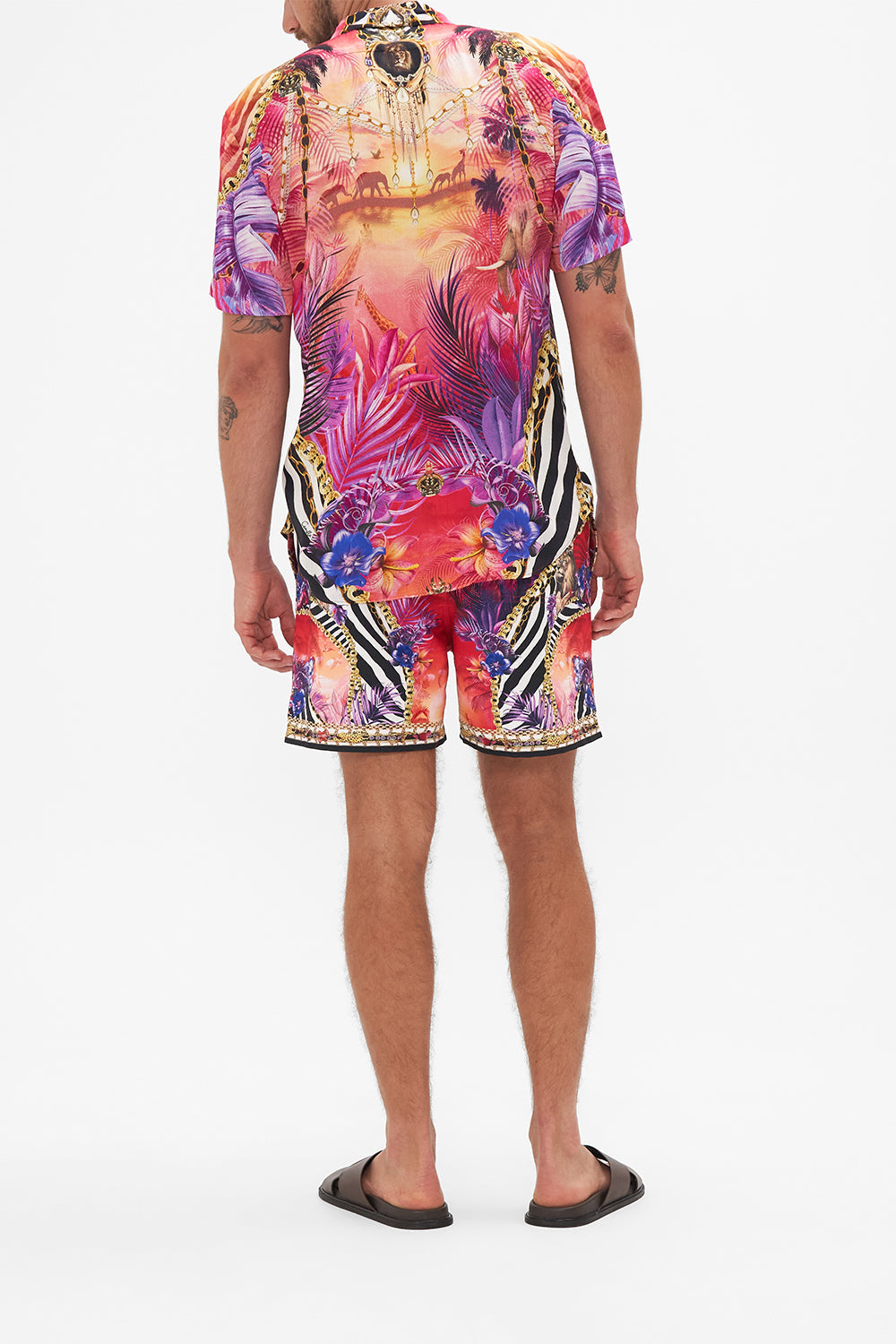 Back view of model wearing Hotel Franks by CAMILLA mens tropical short sleeve button through shirt in Wild Loving print