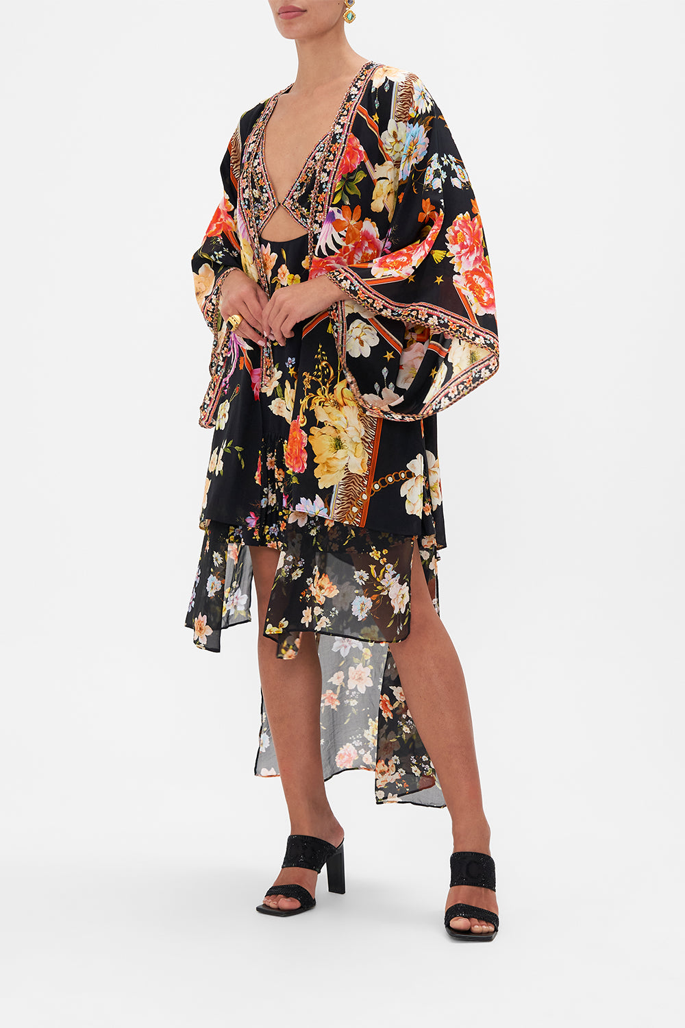 Side view model wearing of CAMILLA floral silk kimono layer in Secret History print