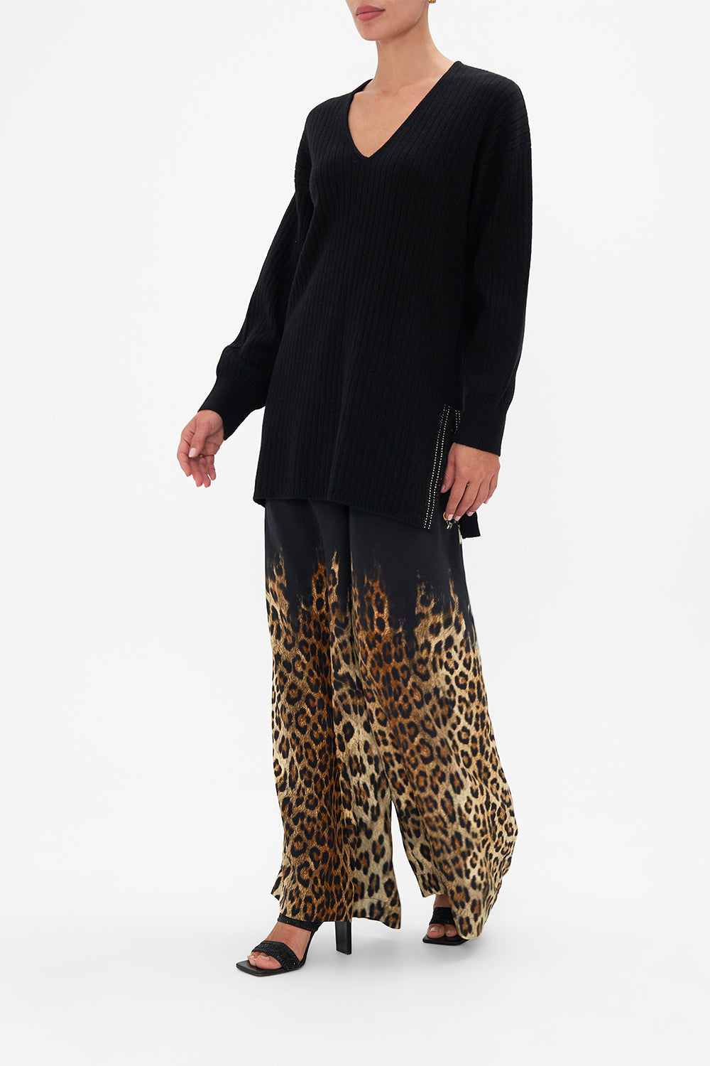 Side view of model wearing CAMILLA black v neck wool cashmere knit jumper in Lions Mane print