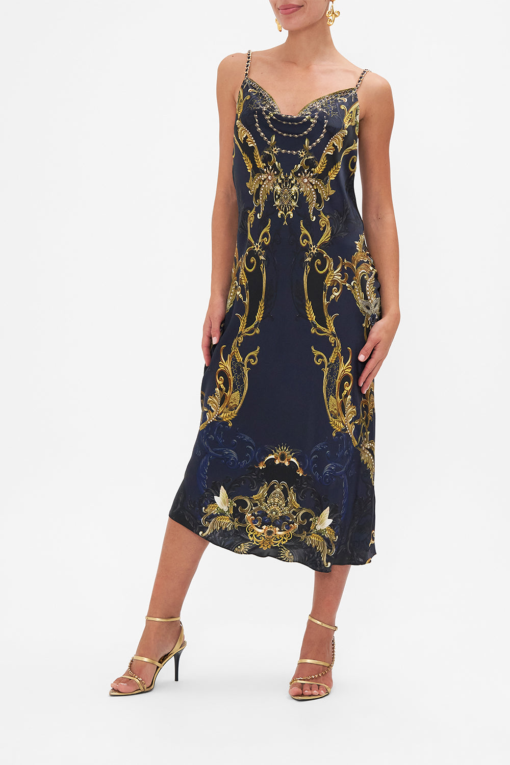 Side view of model wearing CAMILLA bias silk slip dress in Moonlight Melodies print