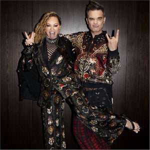 Australian luxury fashion designer Camilla Franks with entertainer Robbie Williams wearing CAMILLA x Robbie Williams collaboration collection